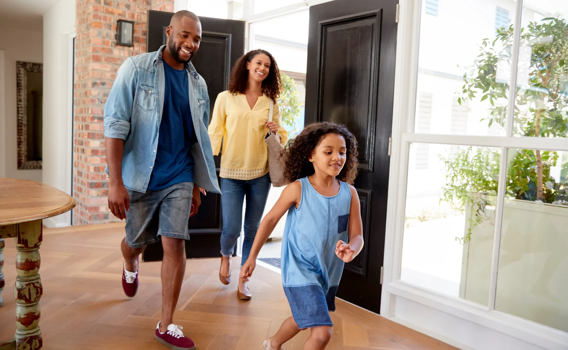 Family arriving home to a guest-ready space
